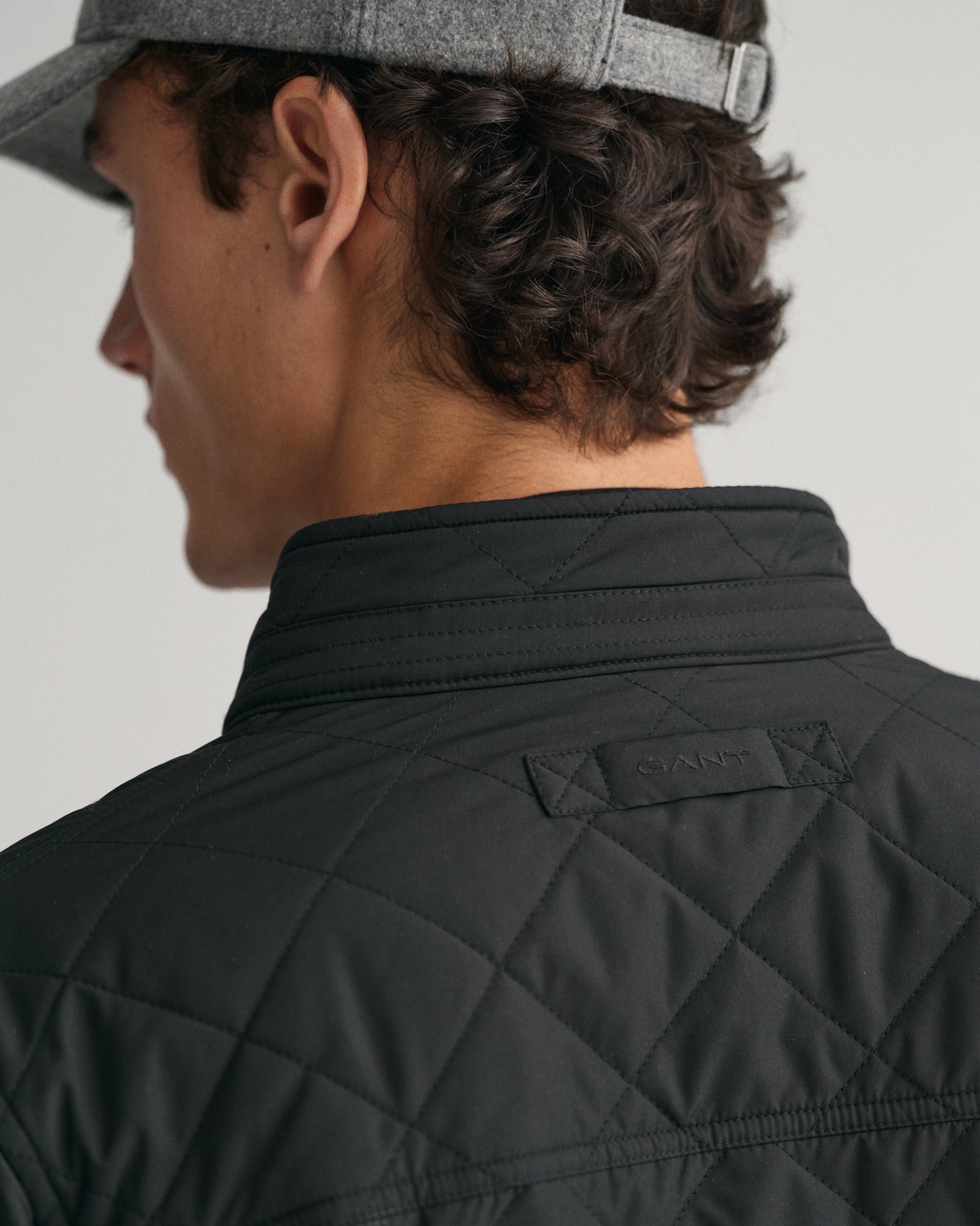 MODEL WEARING QUILTED WINDCHEATER