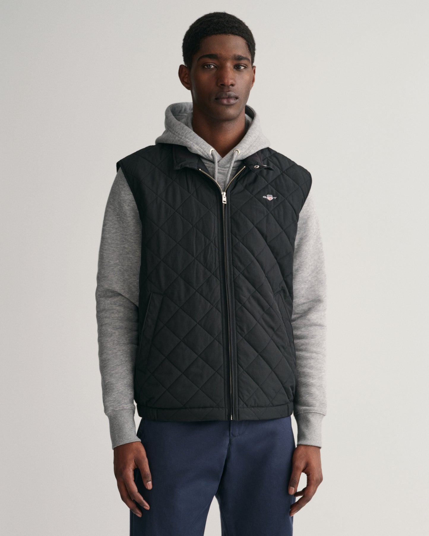 MODEL WEARING QUILTED WINDCHEATER VEST