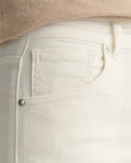 MODEL WEARING SLIM CROPPED WHITE JEANS