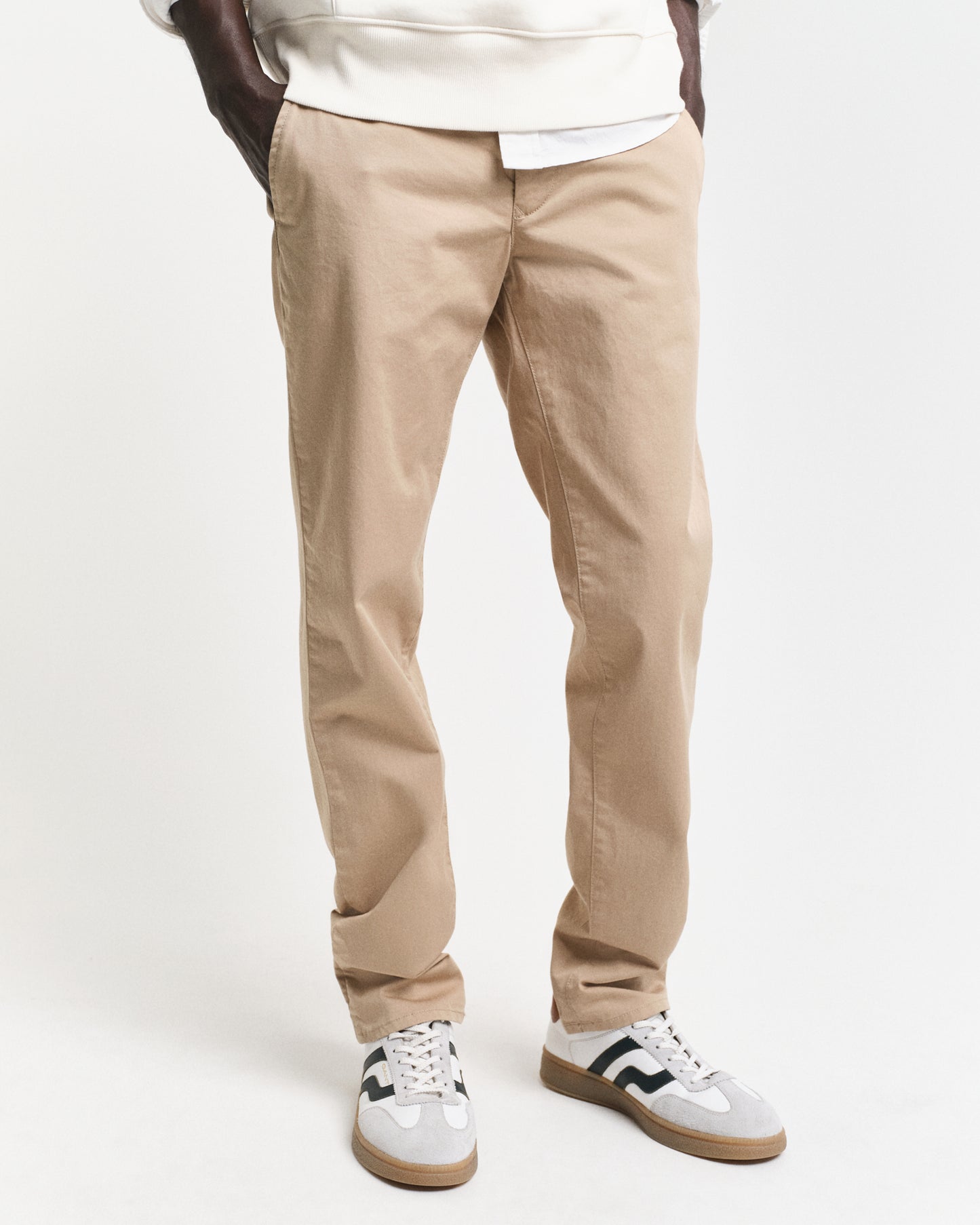 MODEL WEARING SLIM TWILL CHINOS