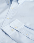LIGHT BLUE, REG PINPOINT OXFORD SHIRT, FLAT-LAY BY GANT AU.