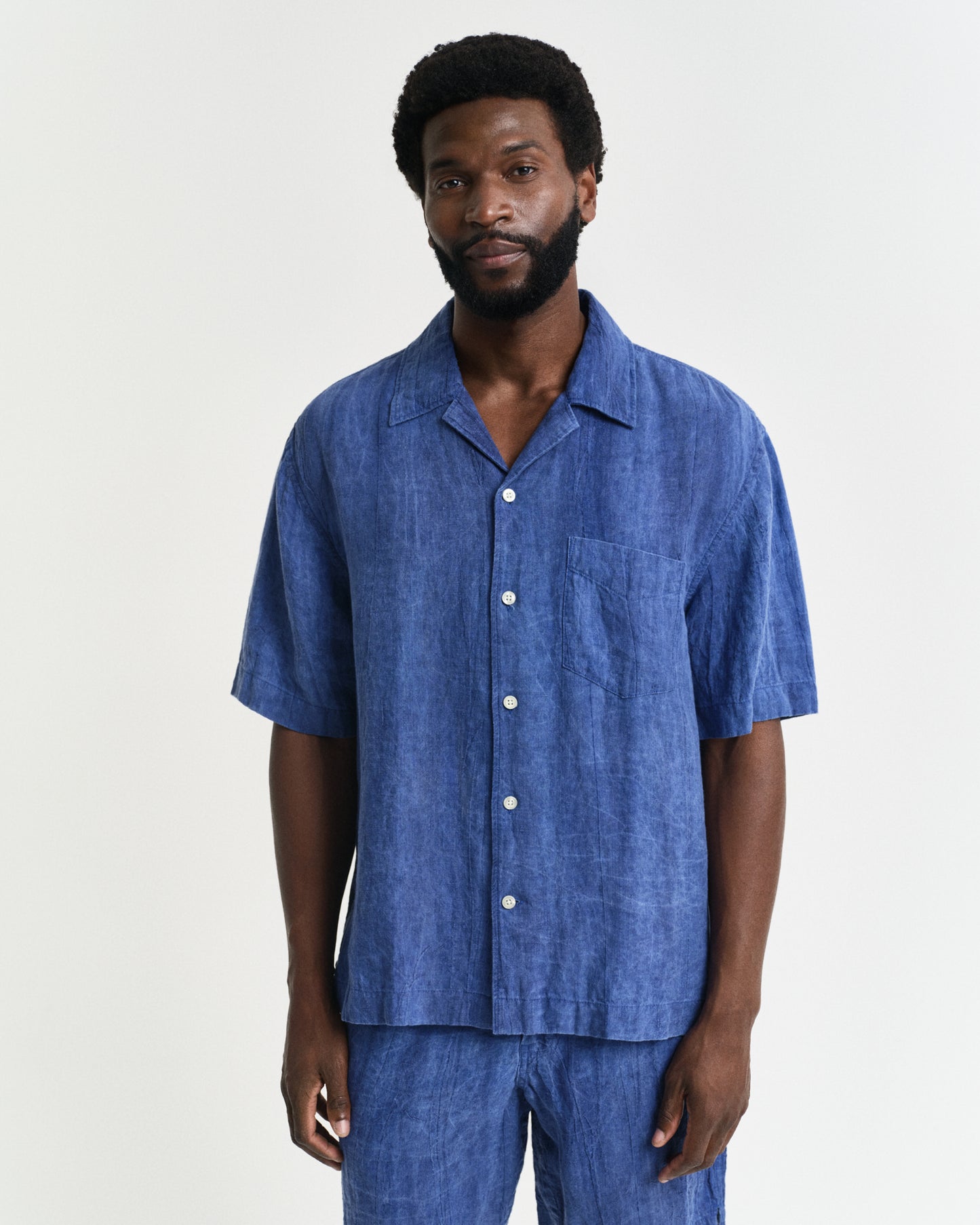 MODEL WEARING REL LINEN RESORT SHIRT