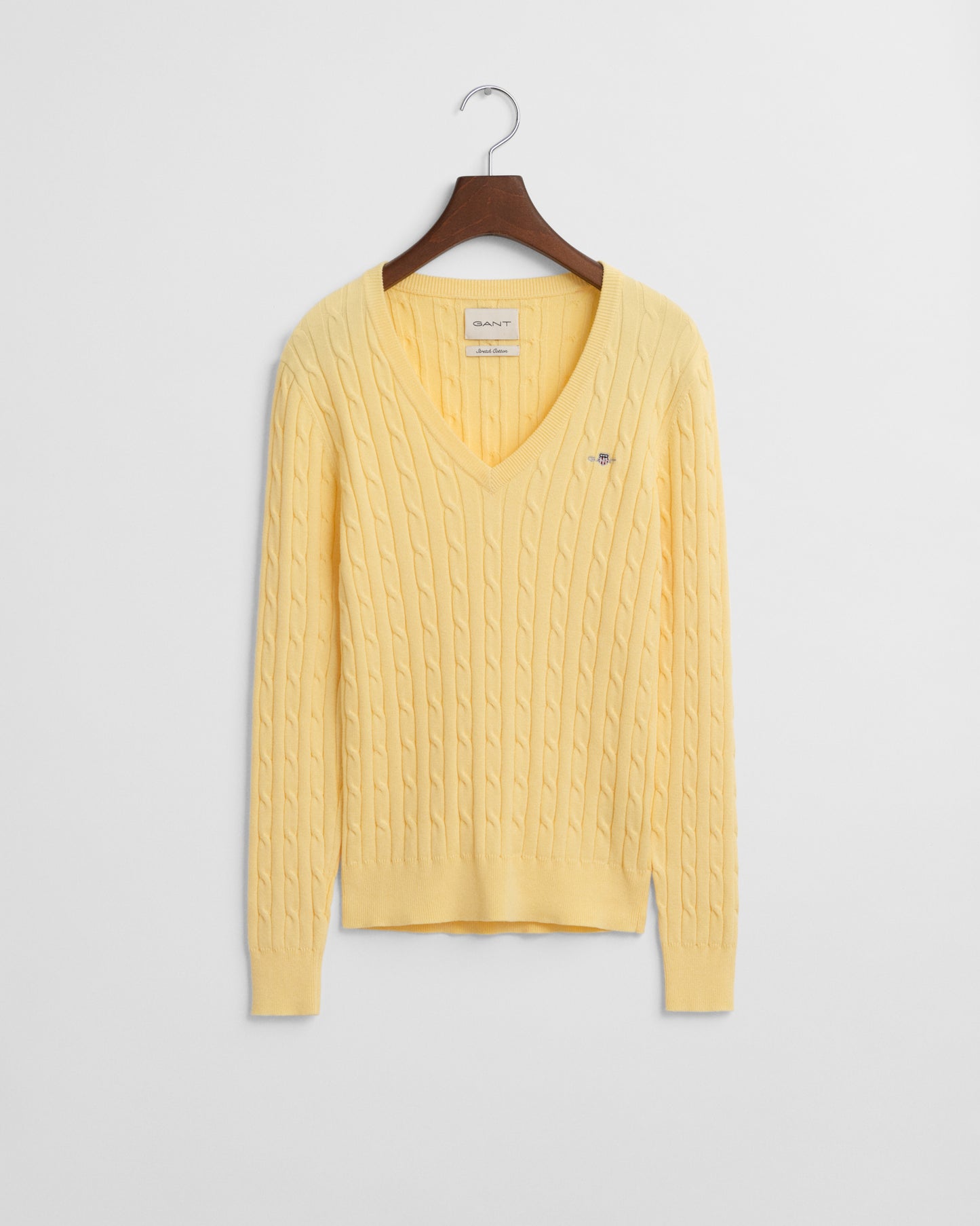 DUSTY LIGHT YELLOW, STRETCH COTTON CABLE V-NECK, FLAT-LAY BY GANT AU.