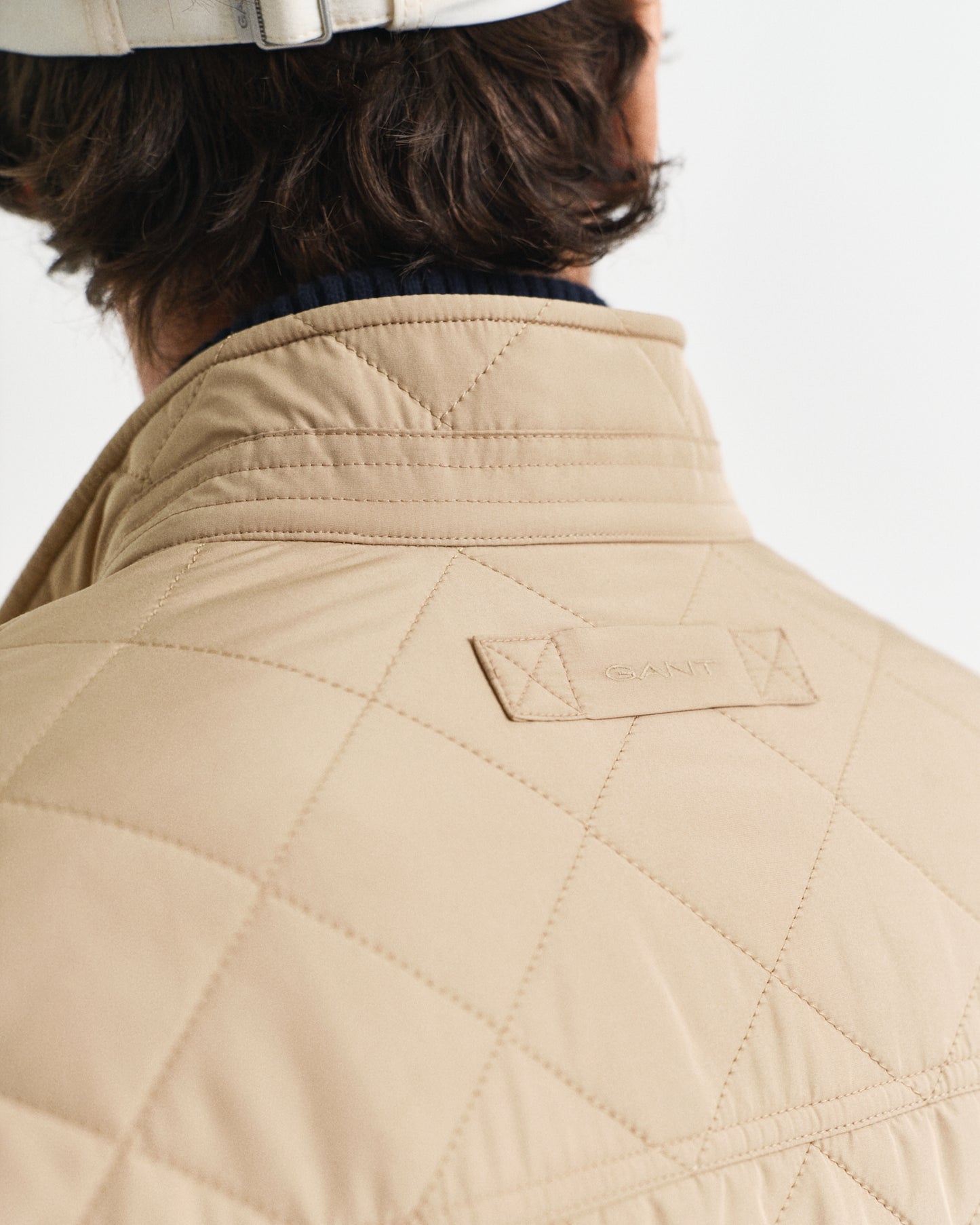 MODEL WEARING QUILTED WINDCHEATER