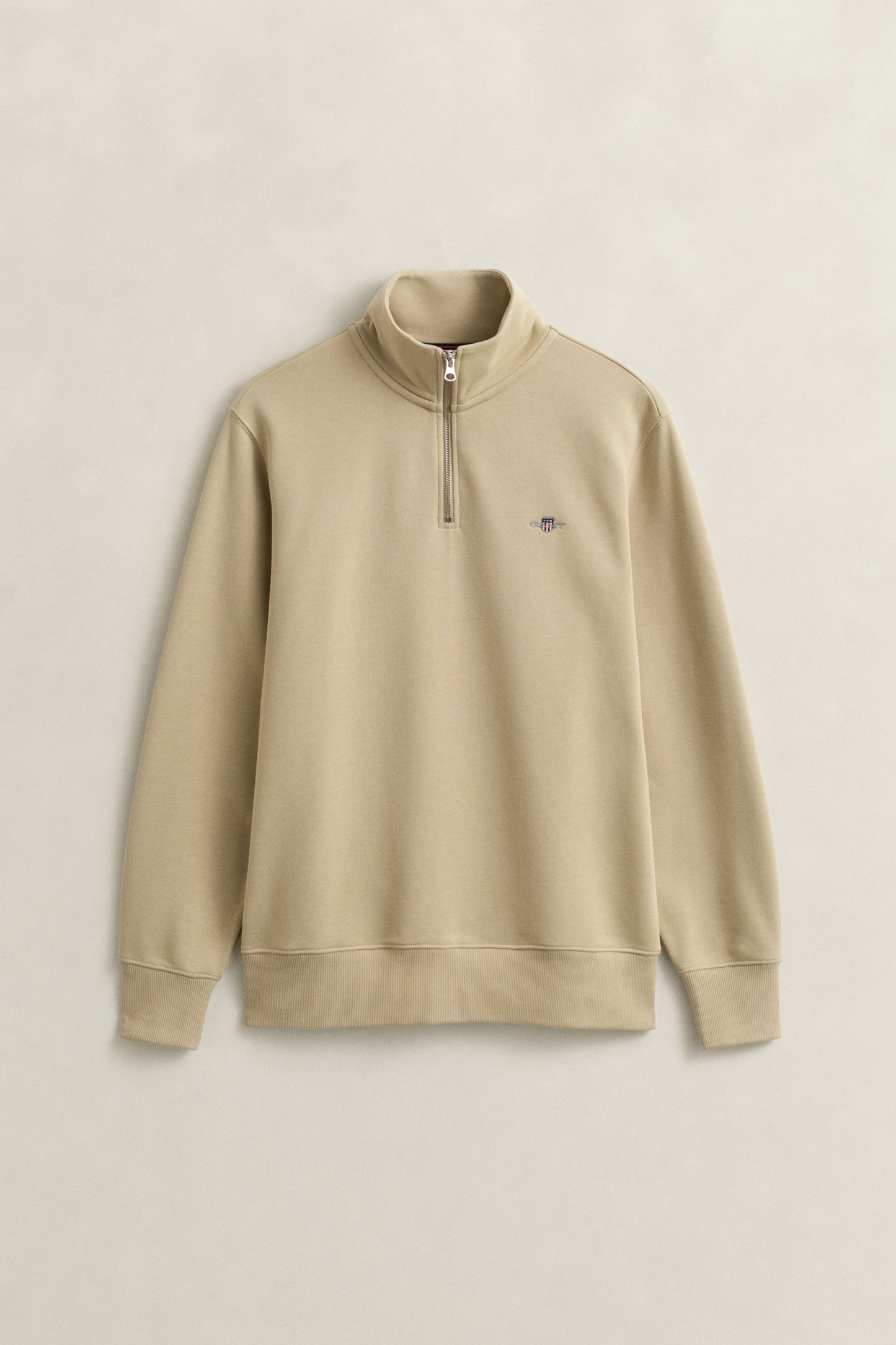 OAT BEIGE, REG SHIELD HALF ZIP SWEAT, FLAT-LAY BY GANT AU.