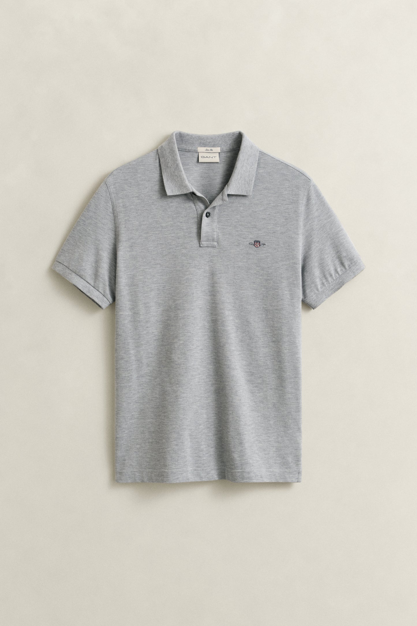 GREY MELANGE, SLIM SHIELD SS PIQUE POLO, FLAT-LAY BY GANT AU.