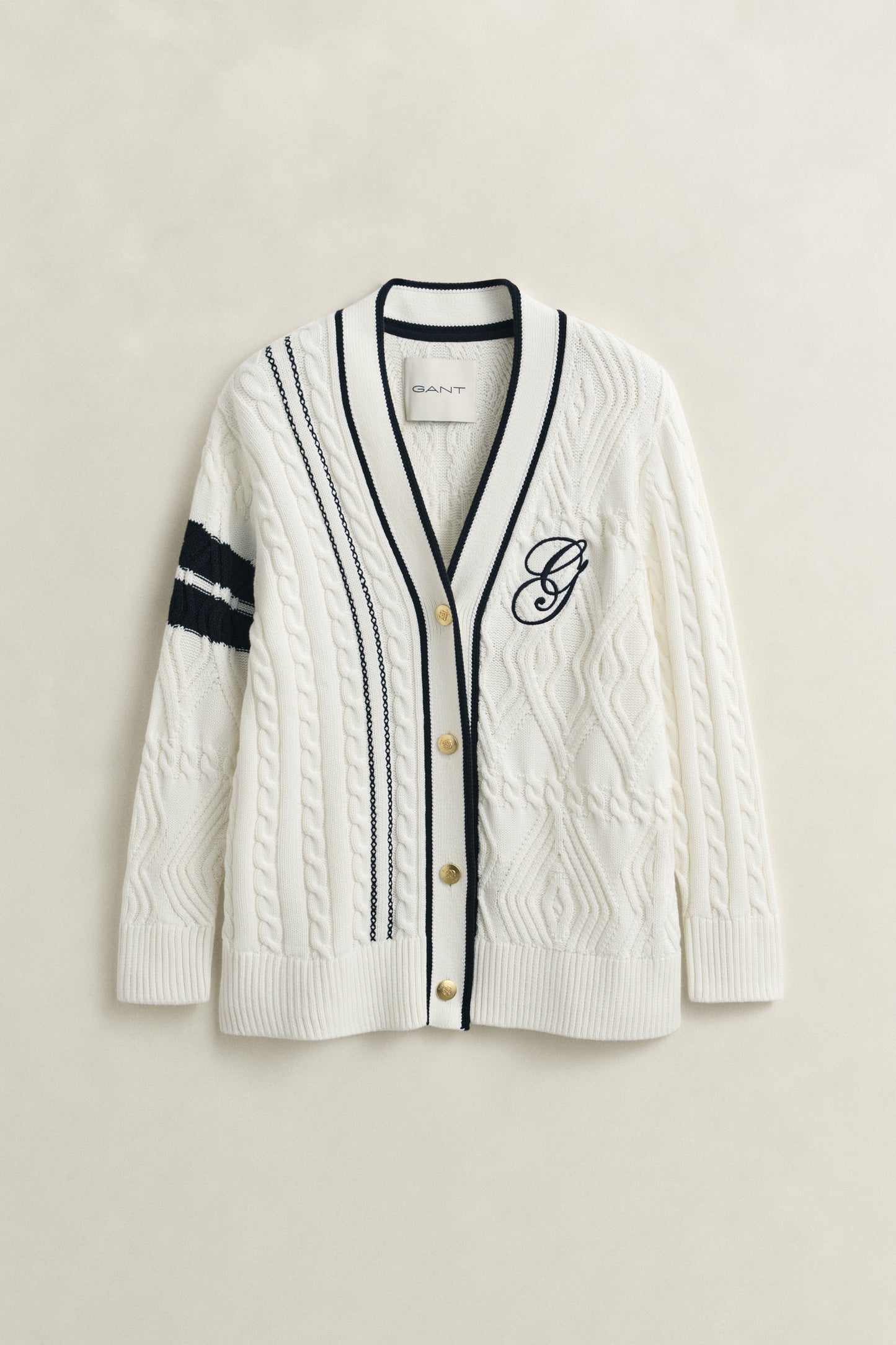 EGGSHELL, GANT VARSITY CABLE CARDIGAN, FLAT-LAY BY GANT AU.