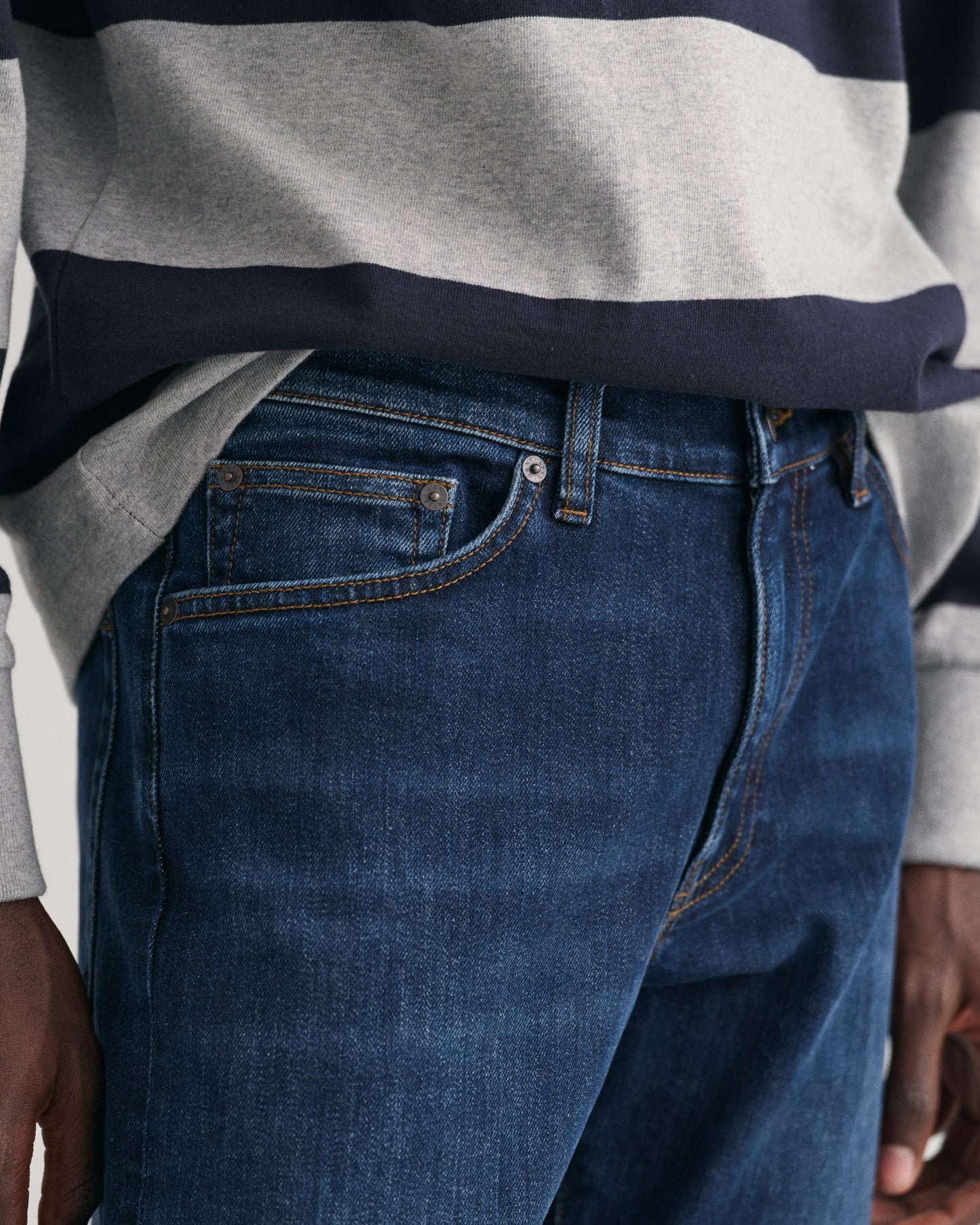 MODEL WEARING SLIM GANT JEANS
