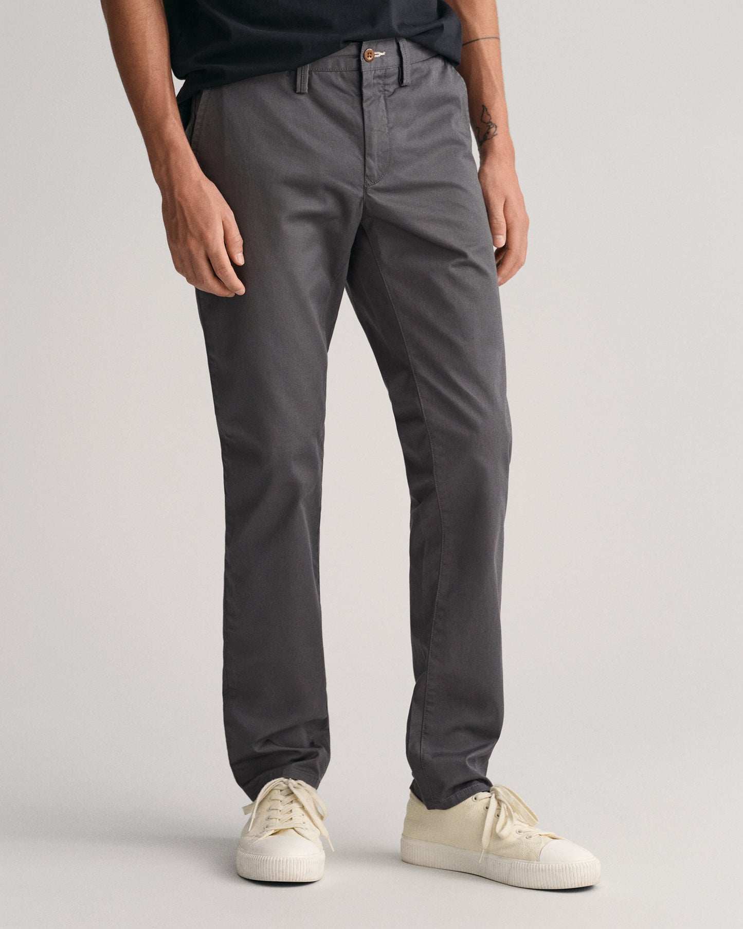 MODEL WEARING SLIM TWILL CHINOS