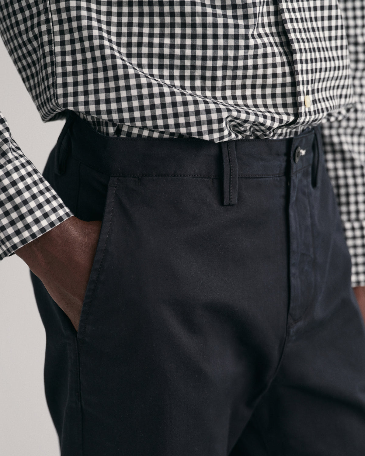 MODEL WEARING REGULAR TWILL CHINOS