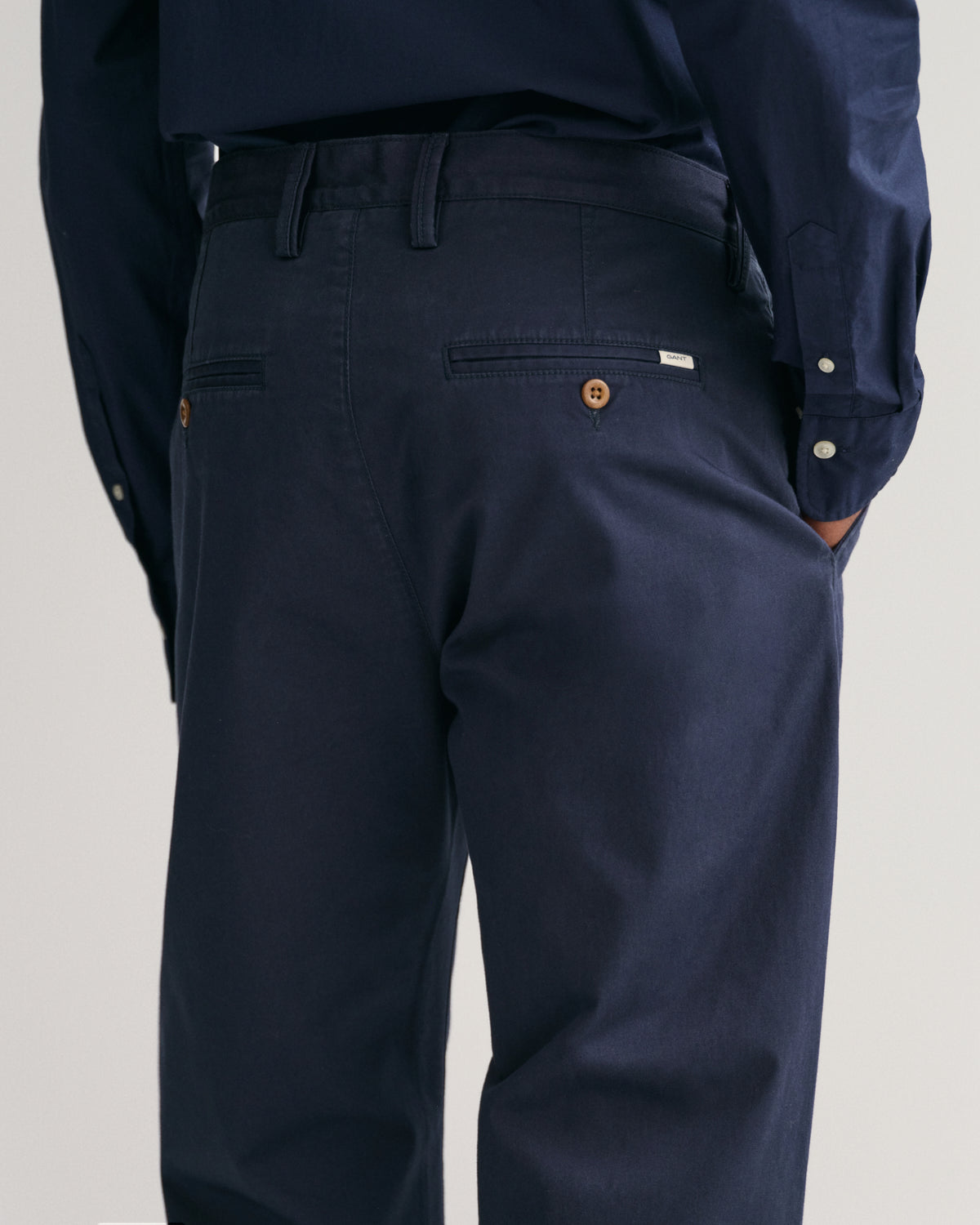 MODEL WEARING REGULAR TWILL CHINOS
