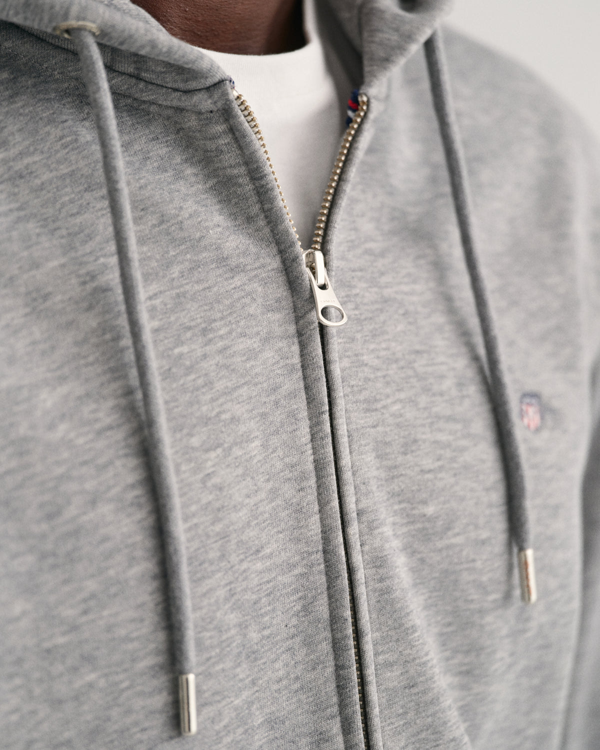 MODEL WEARING REG SHIELD FULL ZIP HOODIE