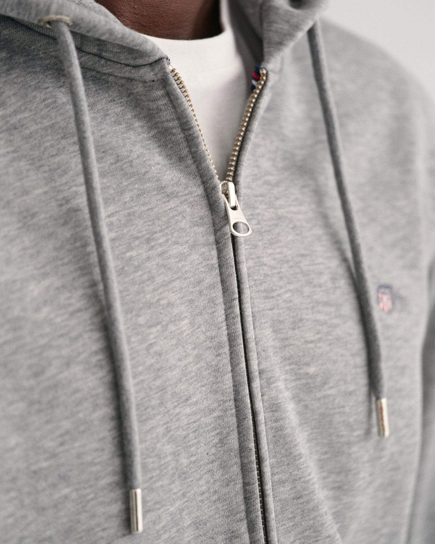MODEL WEARING REG SHIELD FULL ZIP HOODIE