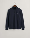 EVENING BLUE, REG SHIELD HALF ZIP SWEAT, FLAT-LAY BY GANT AU.