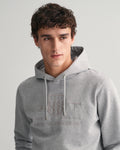 MODEL WEARING REG TONAL SHIELD HOODIE