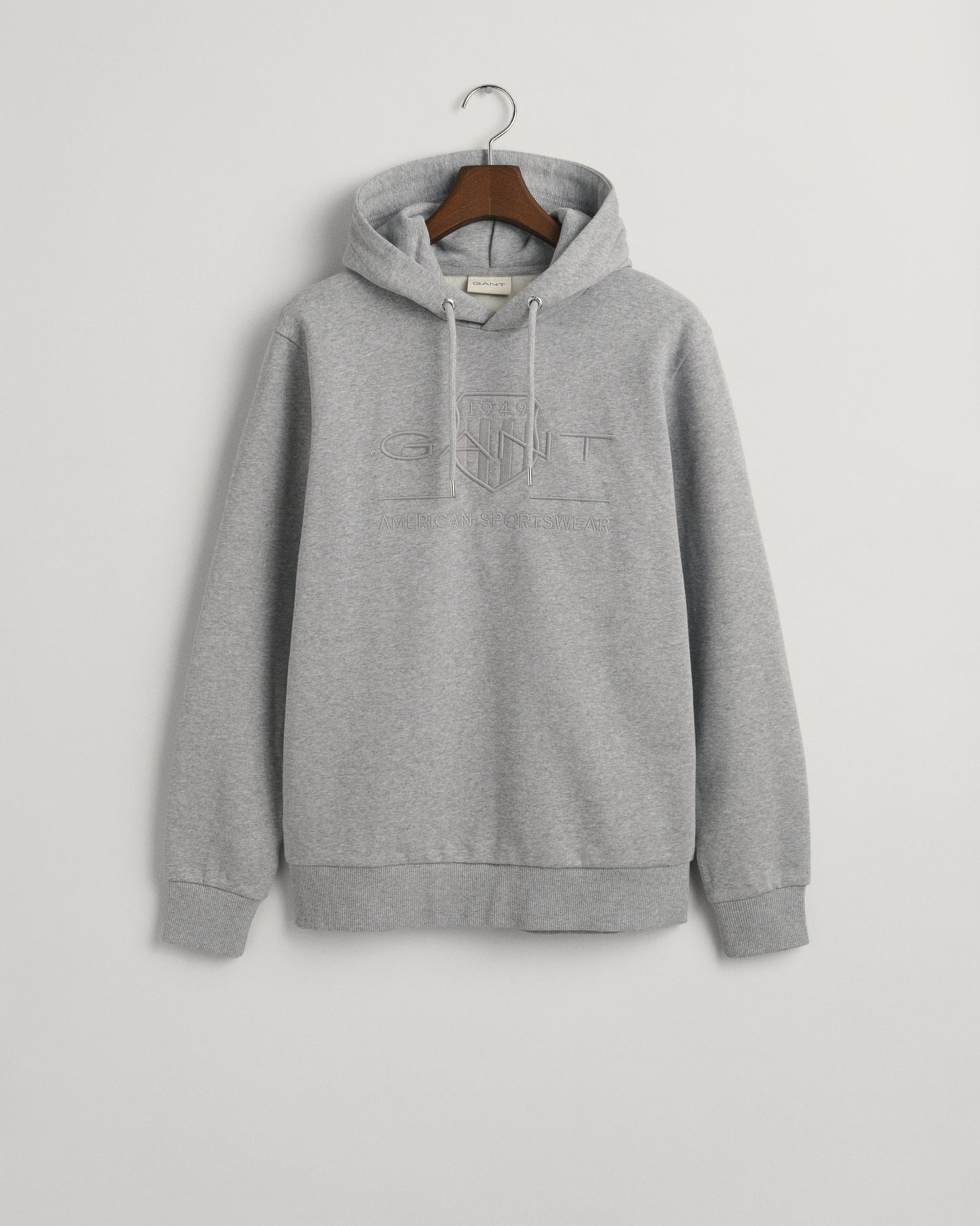 GREY MELANGE, REG TONAL SHIELD HOODIE, FLAT-LAY BY GANT AU.