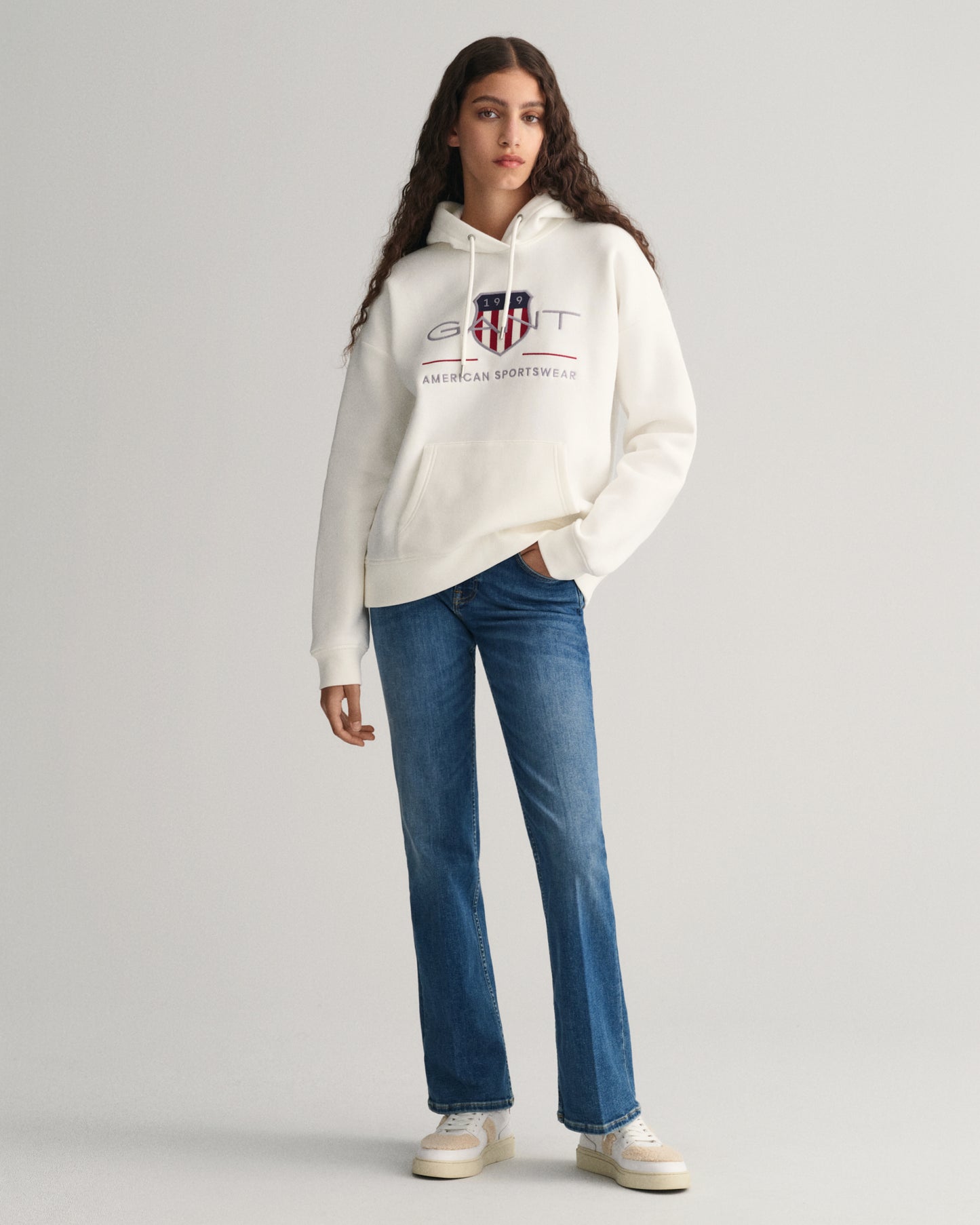 MODEL WEARING REL ARCHIVE SHIELD HOODIE