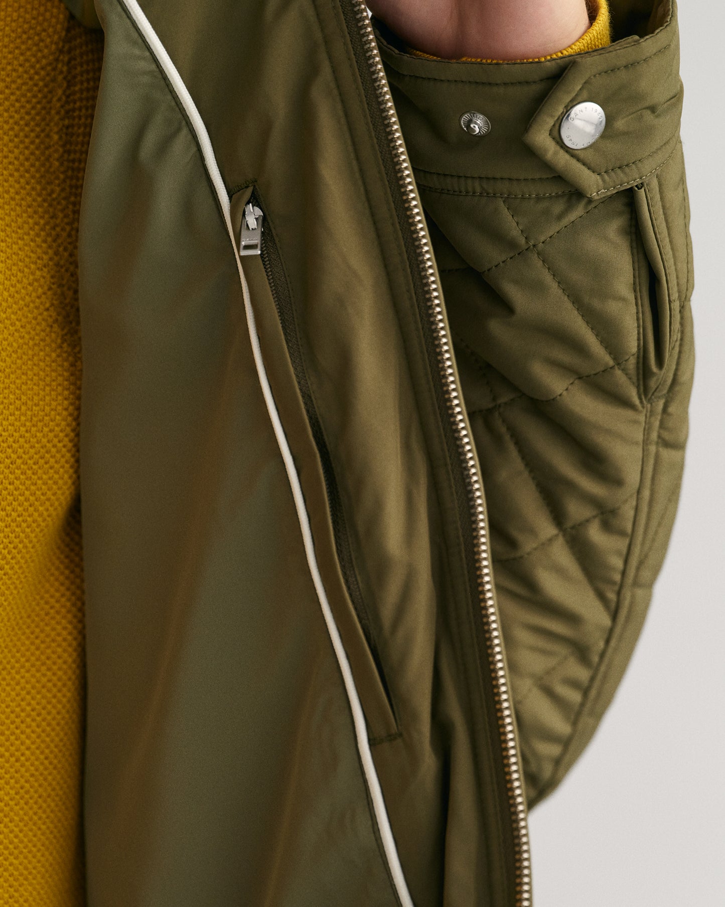 MODEL WEARING QUILTED WINDCHEATER