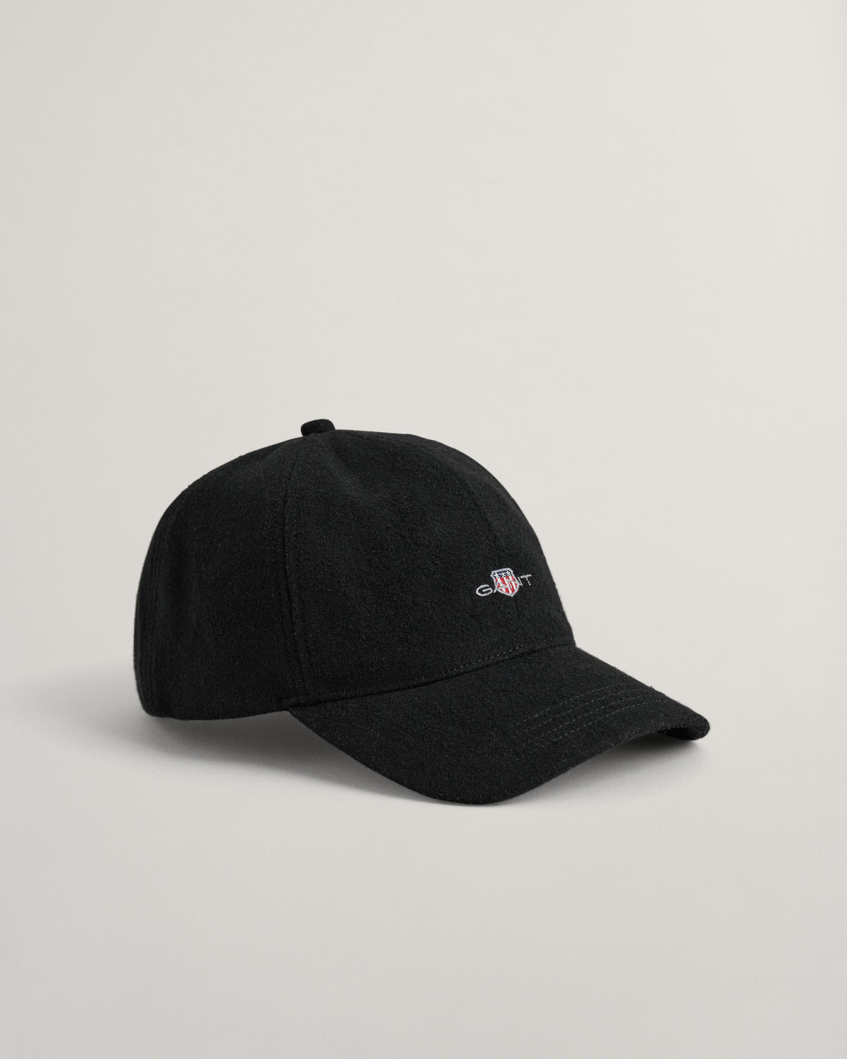 BLACK, SHIELD MELTON CAP, FRONT-VIEW BY GANT AU.