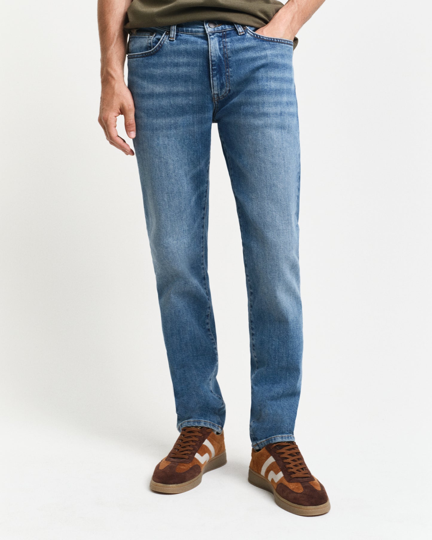 MODEL WEARING SLIM GANT JEANS