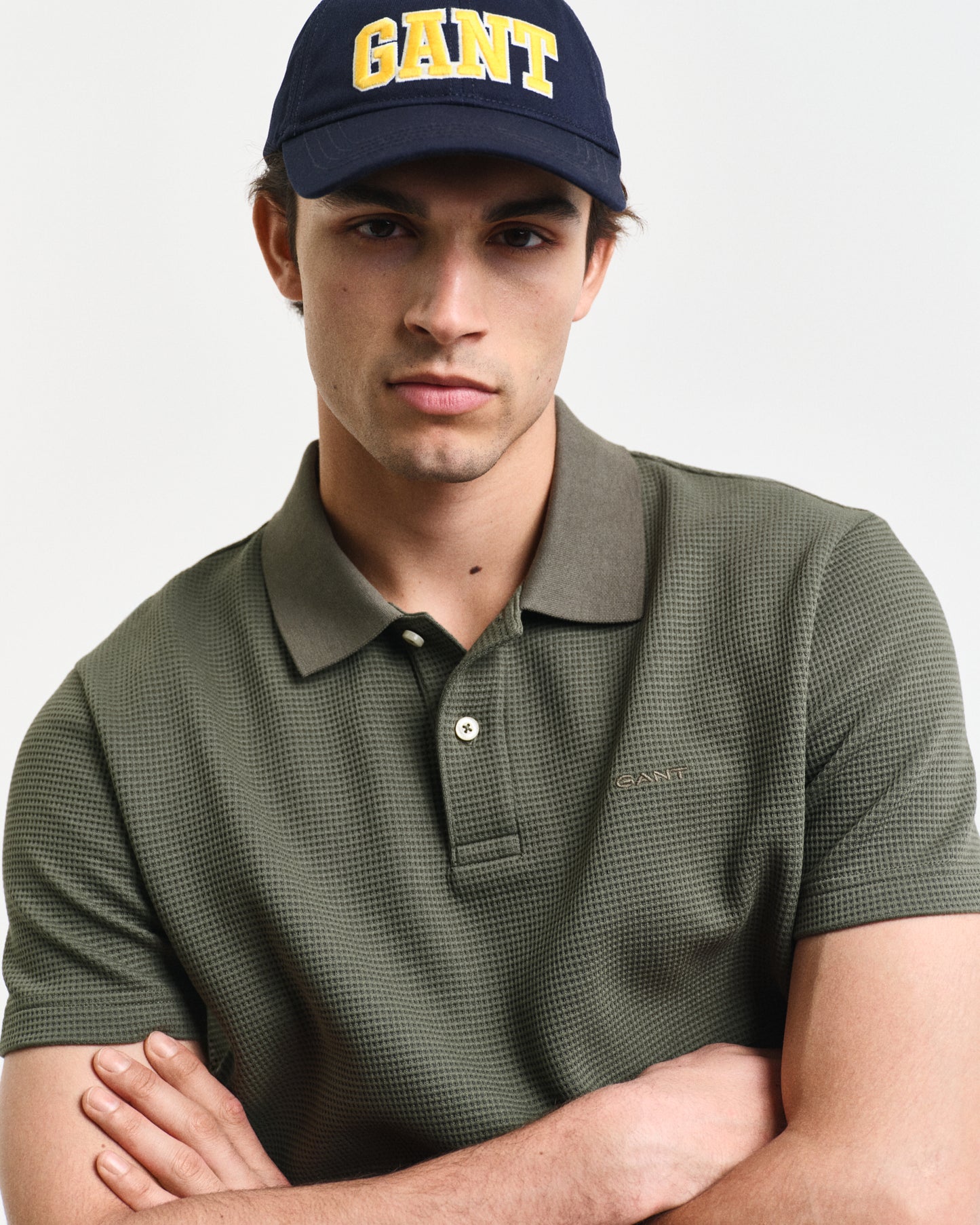 DARK EARTHY GREEN, WAFFLE TEXTURED SS POLO, CLOSE-UP BY GANT AU.