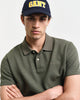 DARK EARTHY GREEN, WAFFLE TEXTURED SS POLO, CLOSE-UP BY GANT AU.