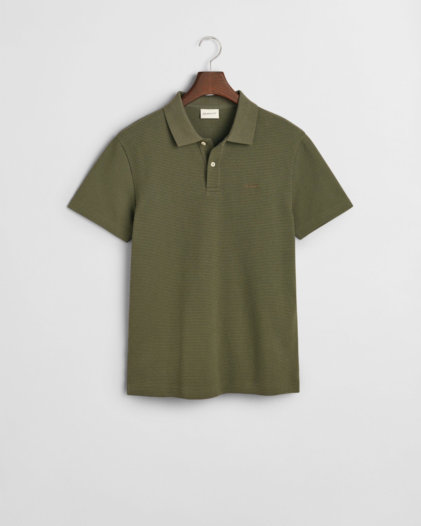 DARK EARTHY GREEN, WAFFLE TEXTURED SS POLO, FLAT-LAY BY GANT AU.