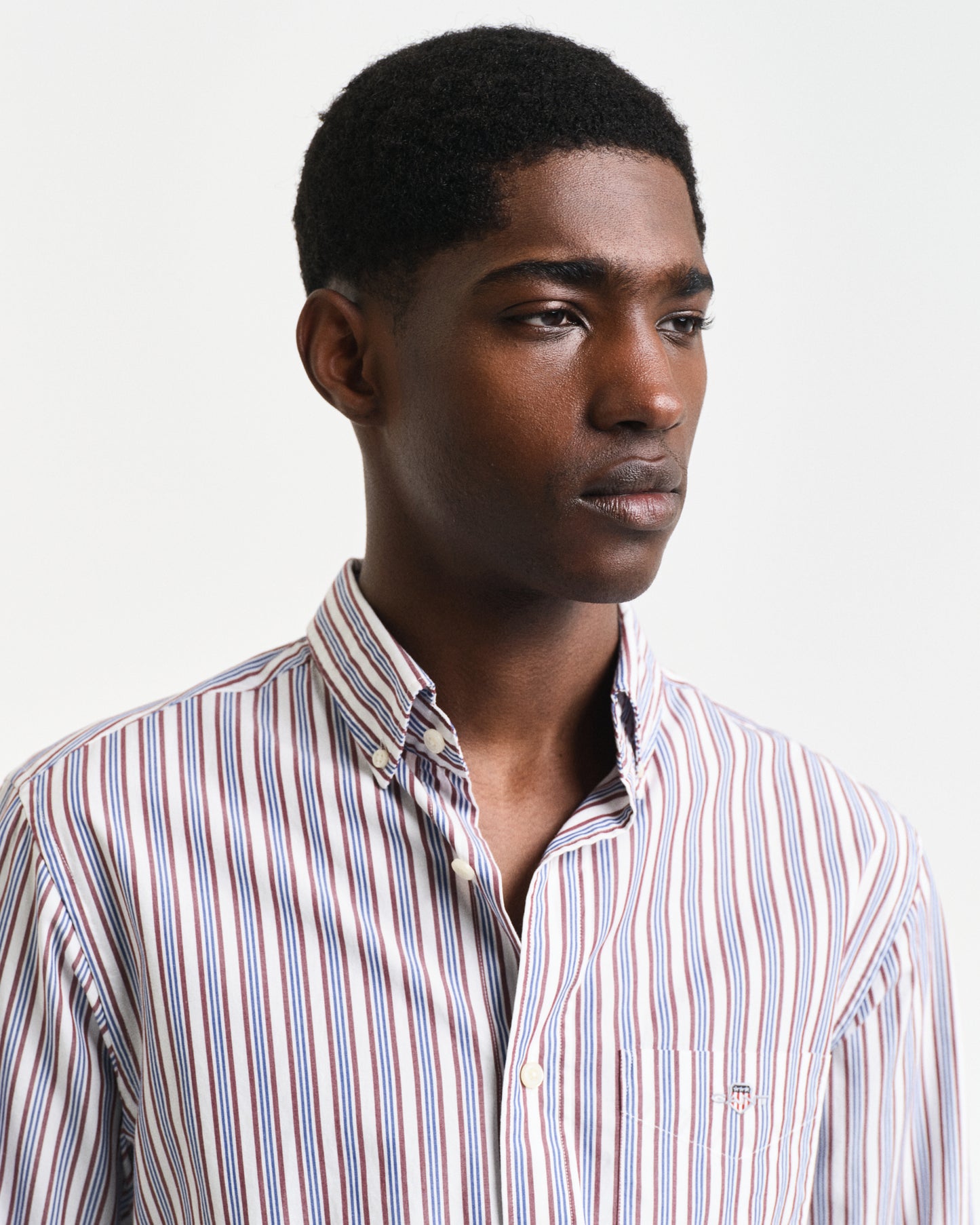 MODEL WEARING REG POPLIN STRIPE SHIRT