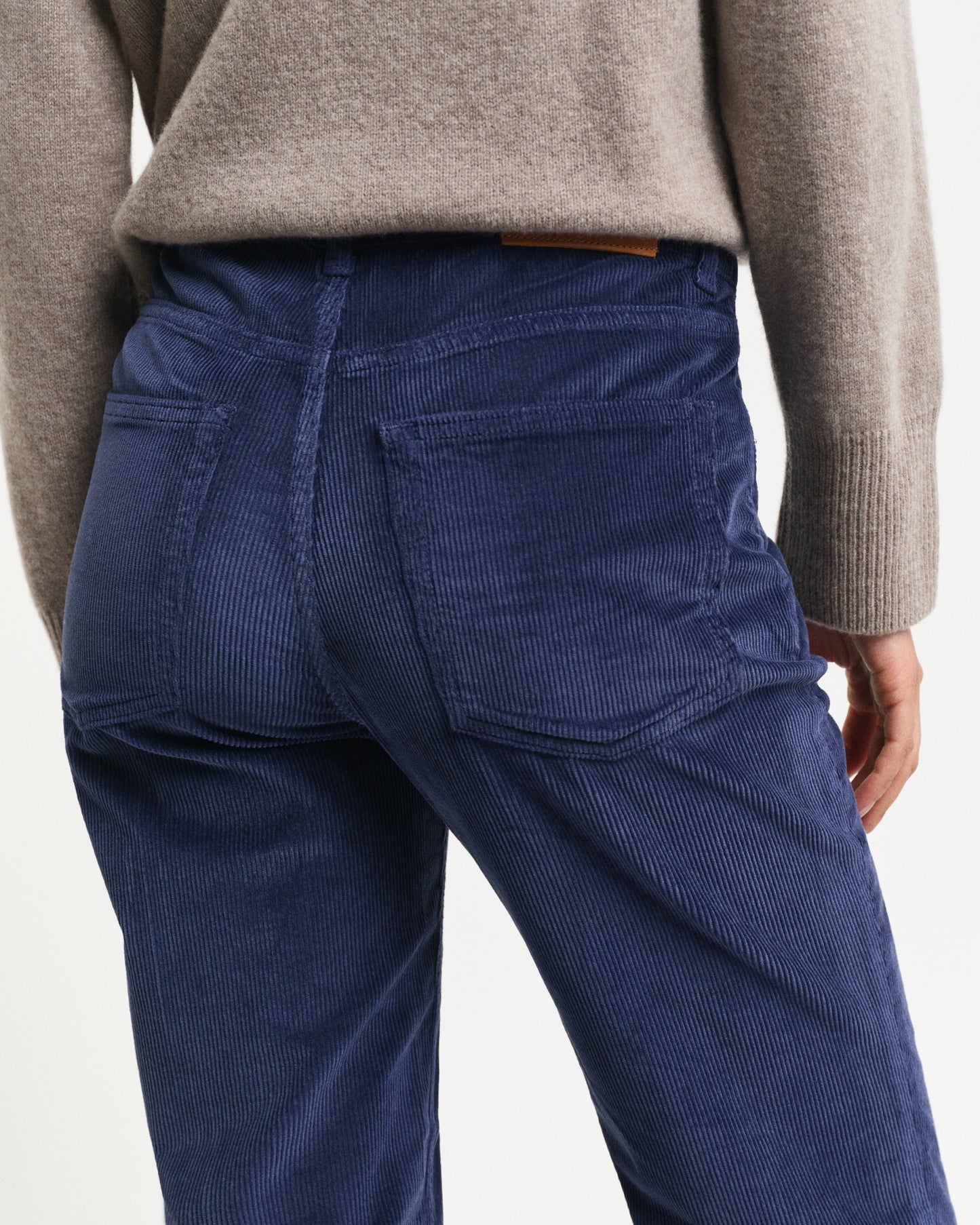 MODEL WEARING CORDUROY FLARE JEANS