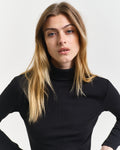 MODEL WEARING SLIM RIB TURTLENECK