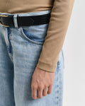 MODEL WEARING SLIM RIB TURTLENECK