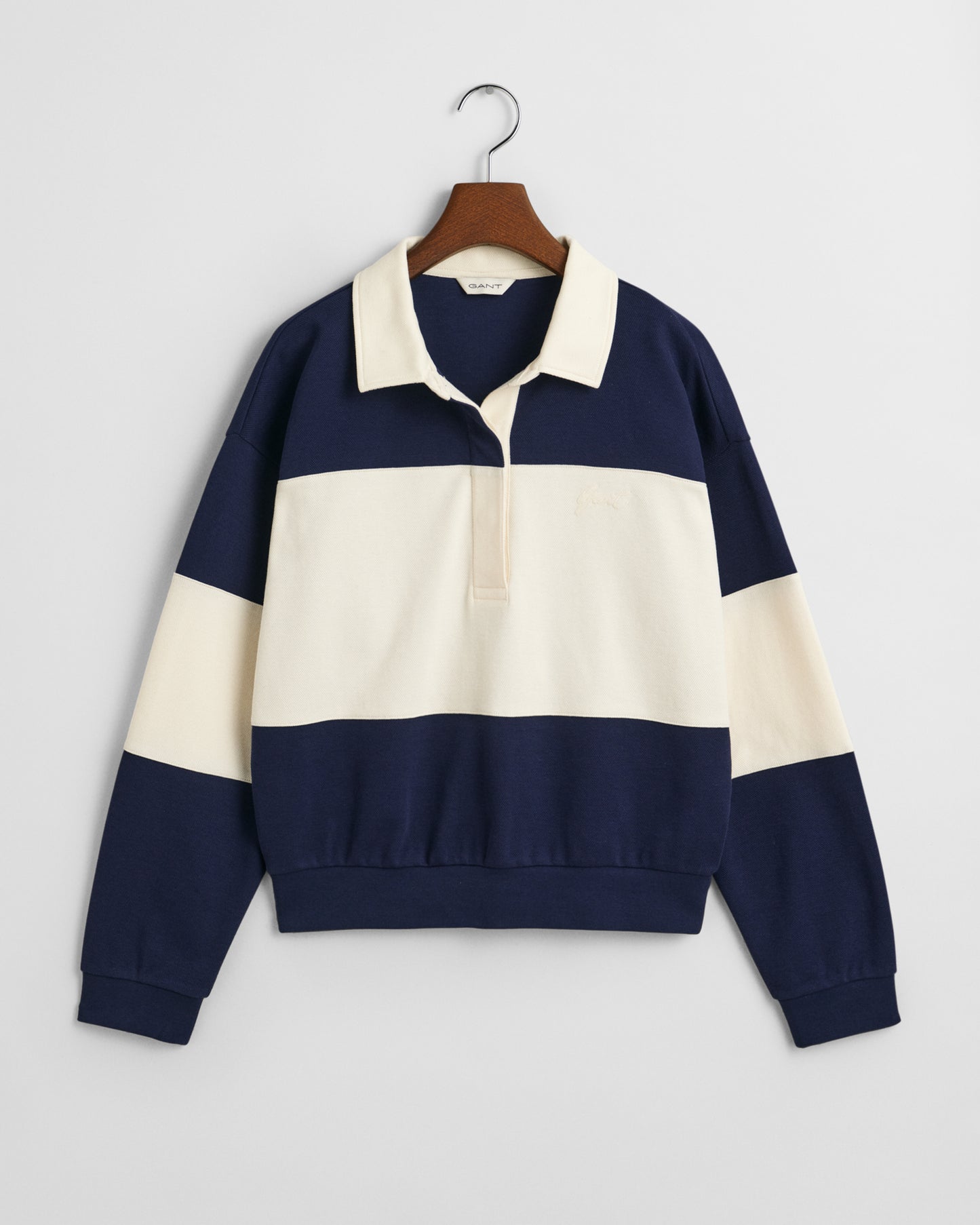 CLASSIC BLUE, PIQUE TEXTURE COLOR BLOCK RUGGER, FLAT-LAY BY GANT AU.