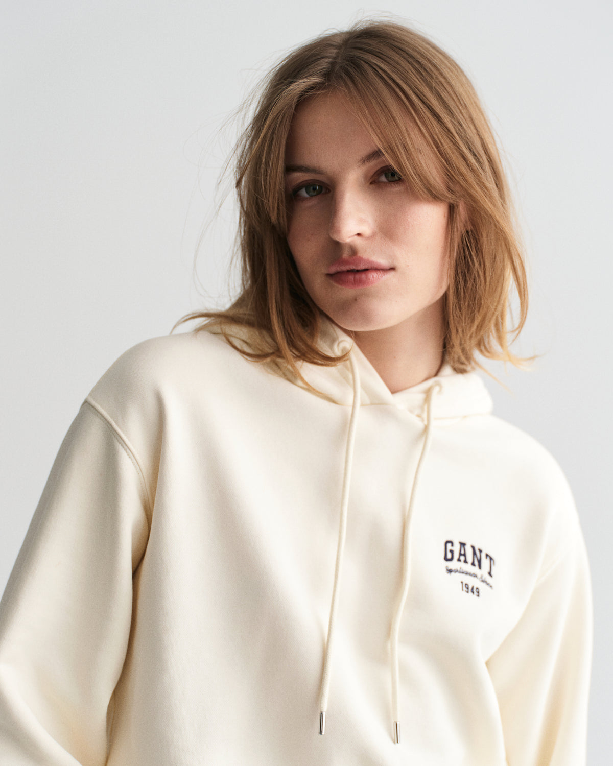 MODEL WEARING SMALL GRAPHIC HOODIE