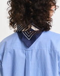 MODEL WEARING REL CLASSIC POPLIN STRIPED SHIRT