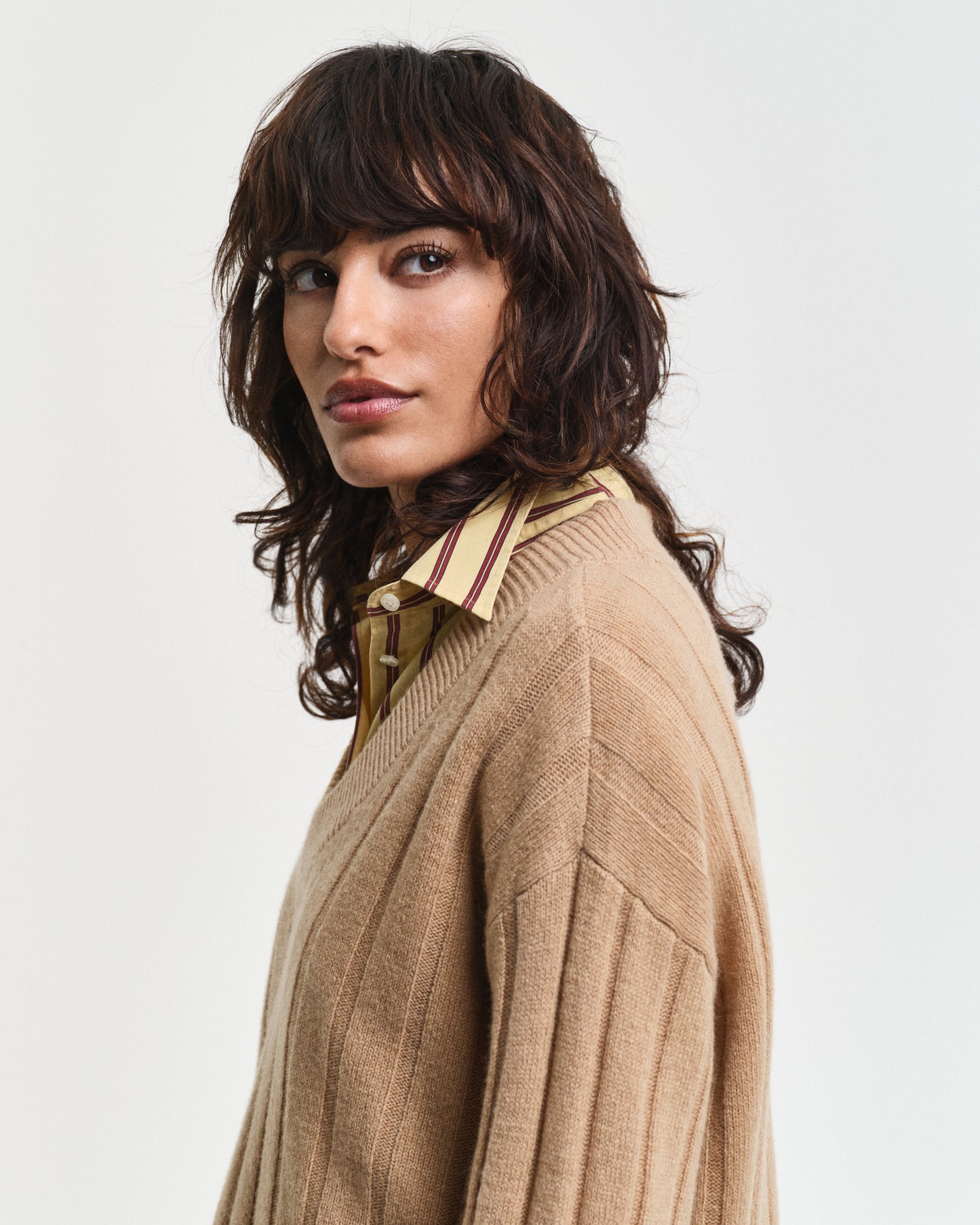 MODEL WEARING WIDE RIBBED WOOL V-NECK
