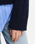 MODEL WEARING WIDE RIBBED WOOL V-NECK