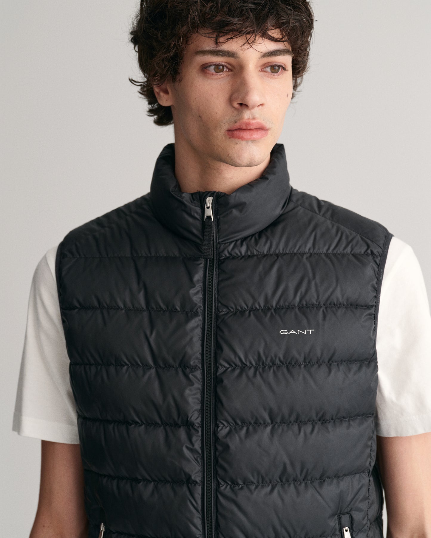MODEL WEARING LIGHT DOWN VEST