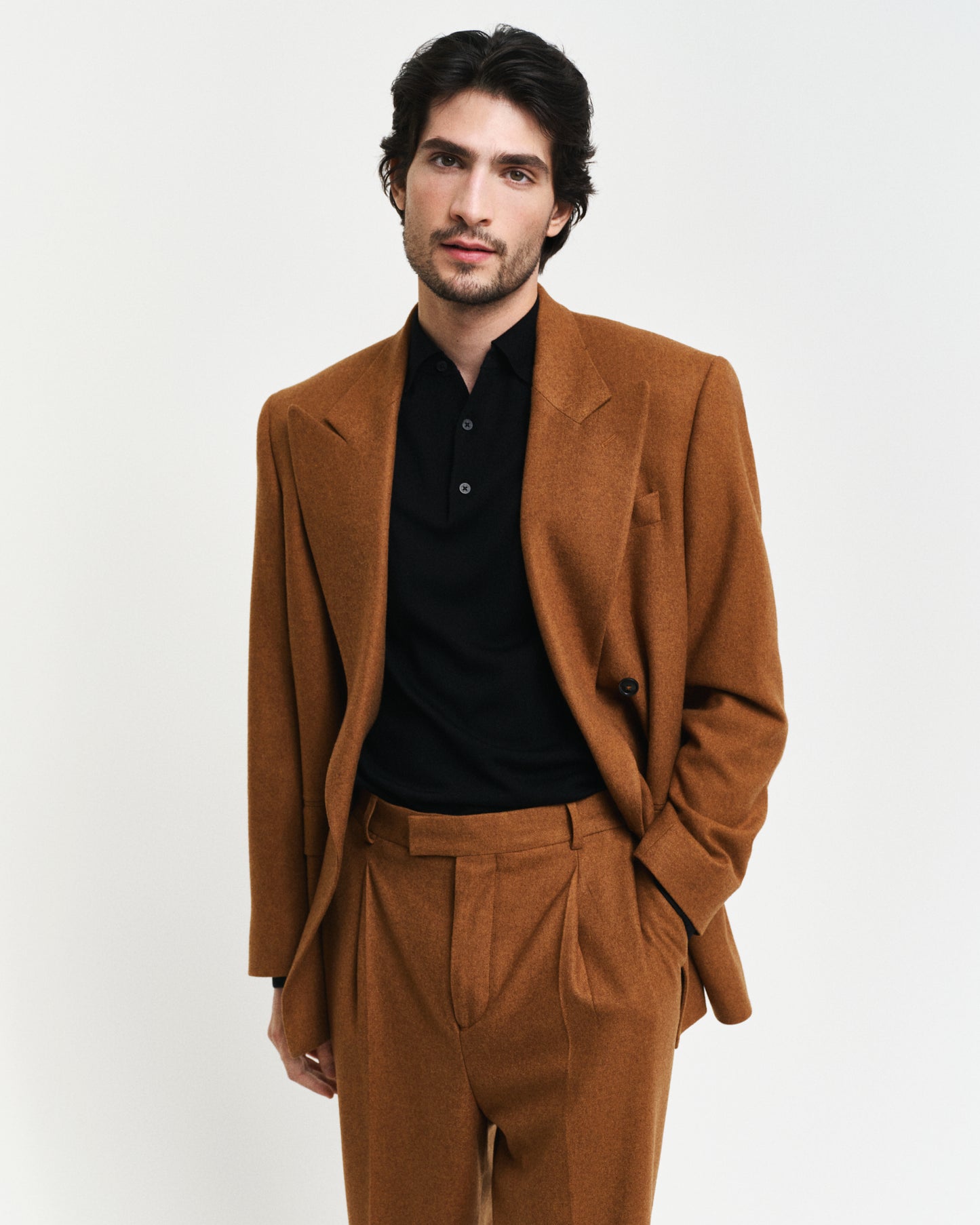 MODEL WEARING EXTRAFINE MERINO WOOL POLO