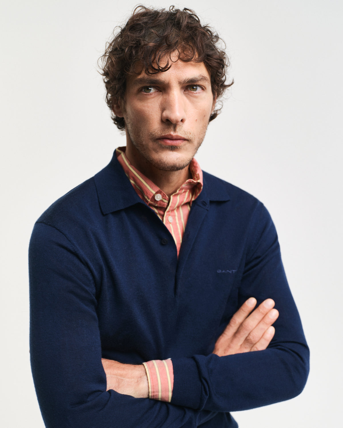 MODEL WEARING EXTRAFINE MERINO WOOL POLO