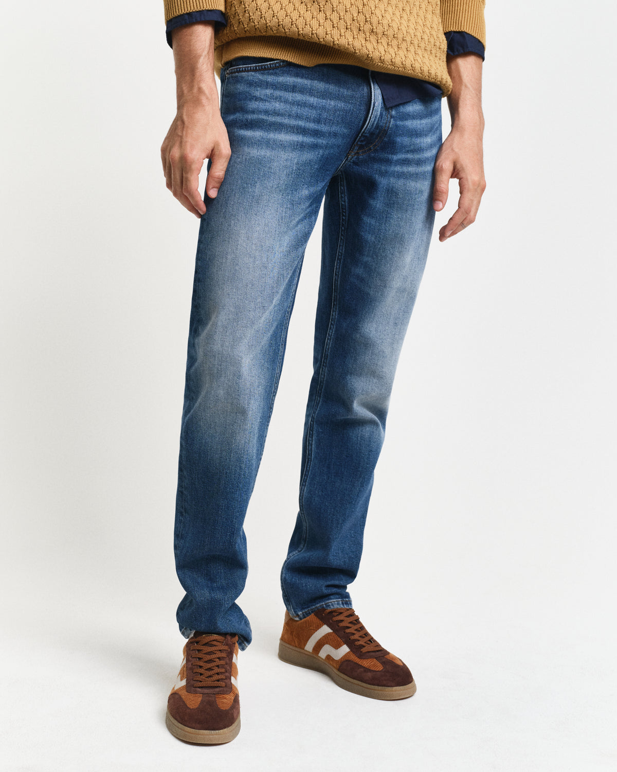 MODEL WEARING SLIM GANT JEANS