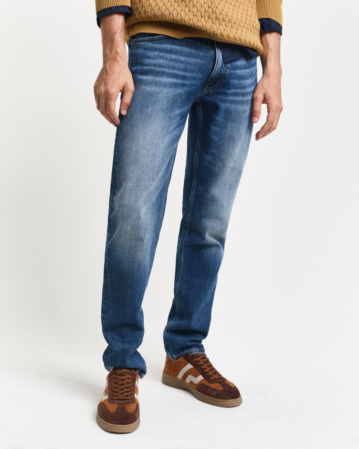 MODEL WEARING SLIM GANT JEANS