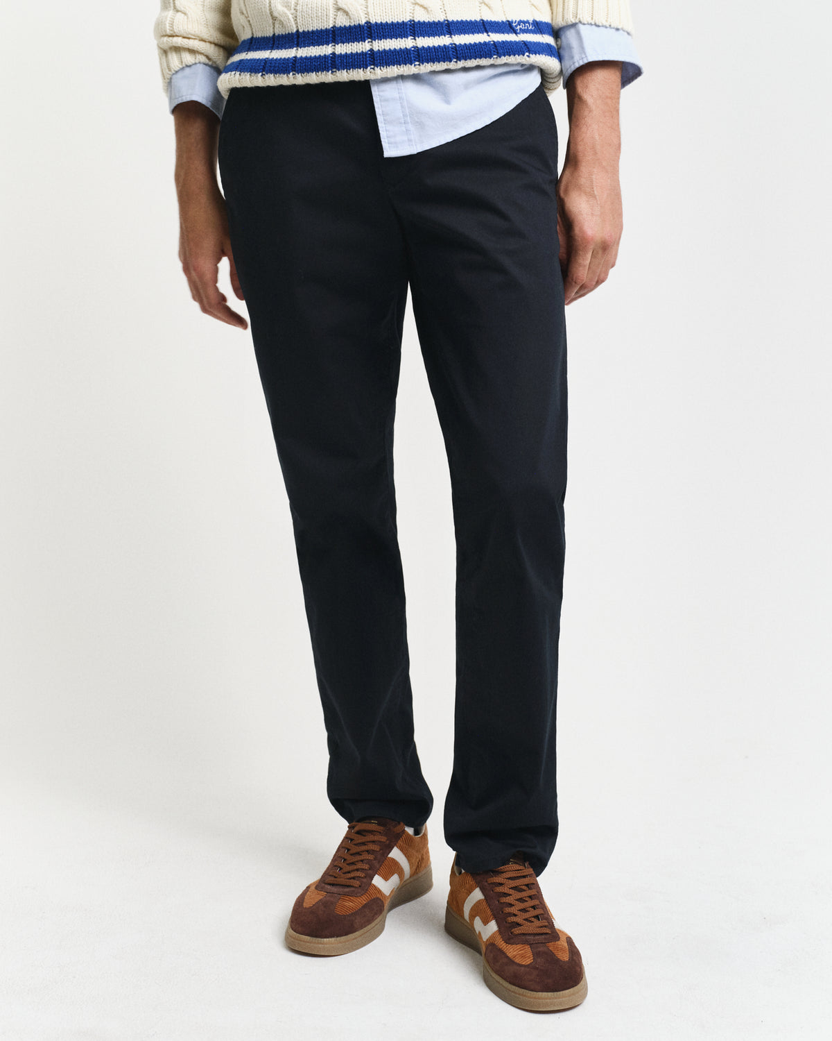 MODEL WEARING SLIM TWILL CHINOS