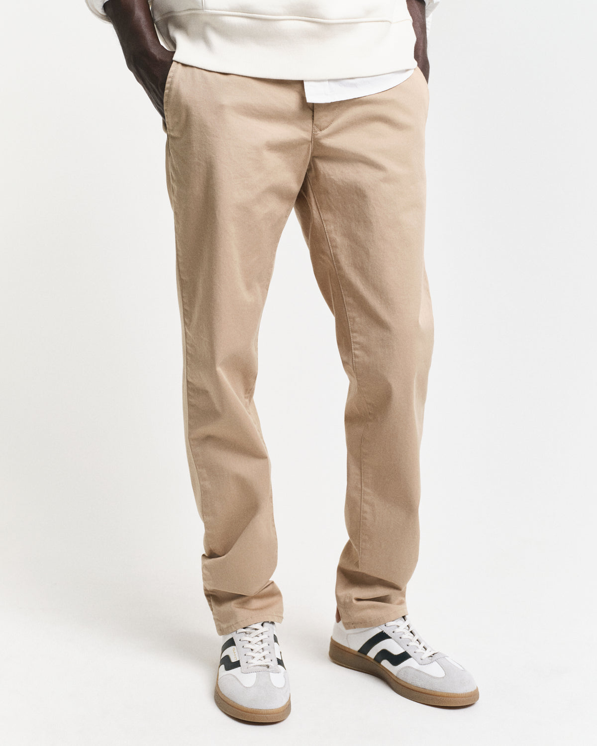 MODEL WEARING SLIM TWILL CHINOS
