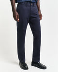MODEL WEARING SLIM TWILL CHINOS