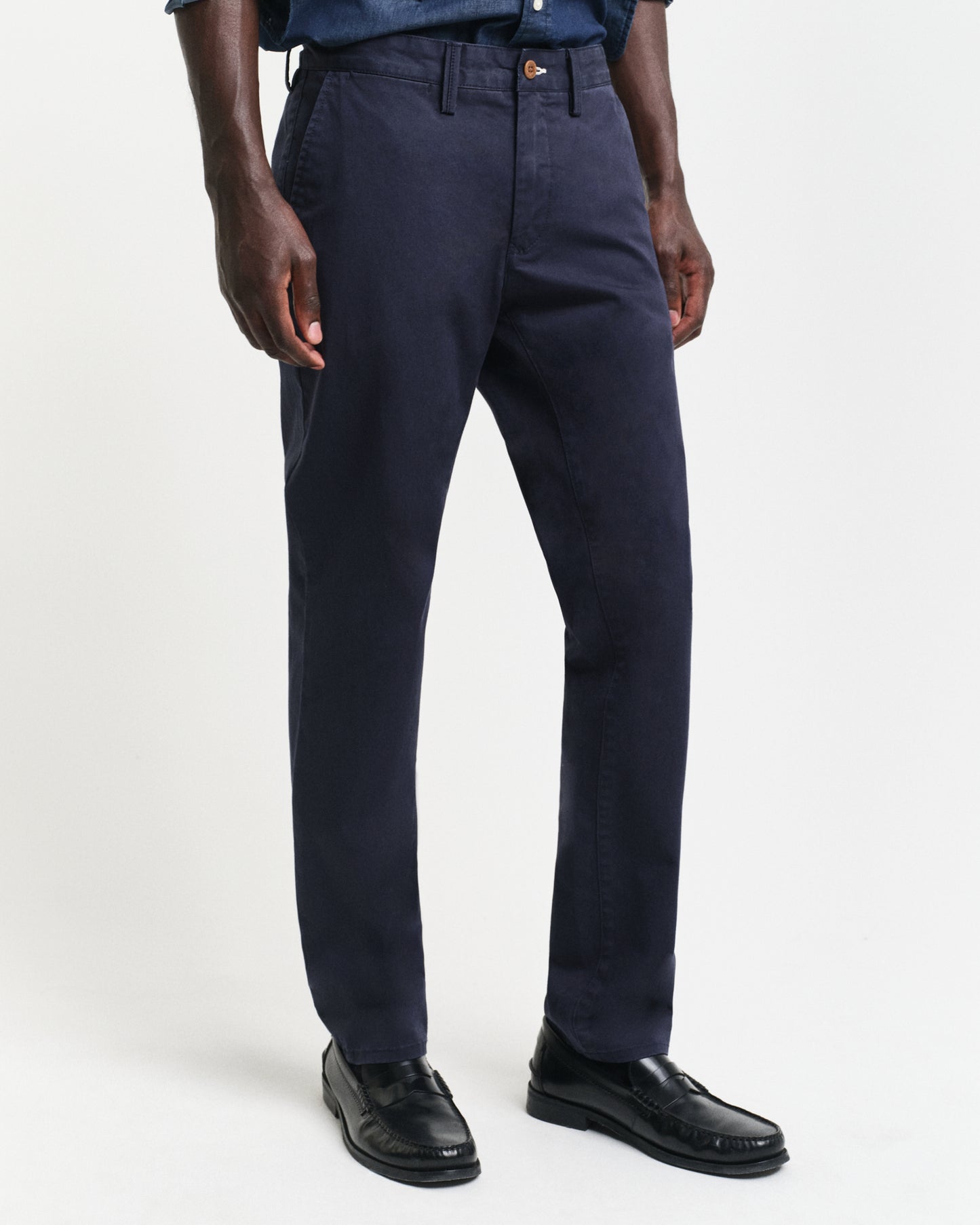 MODEL WEARING SLIM TWILL CHINOS