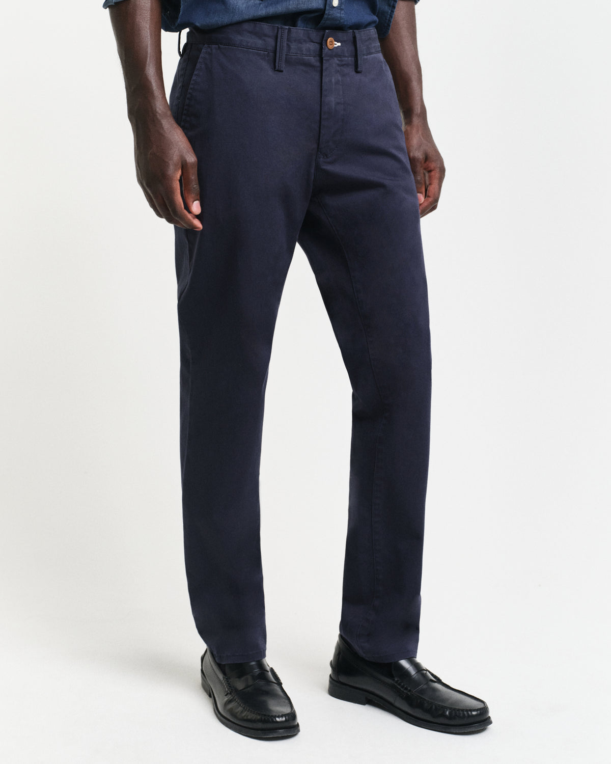 MODEL WEARING SLIM TWILL CHINOS