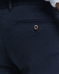 MODEL WEARING SLIM DOBBY STRUCTURE CHINOS