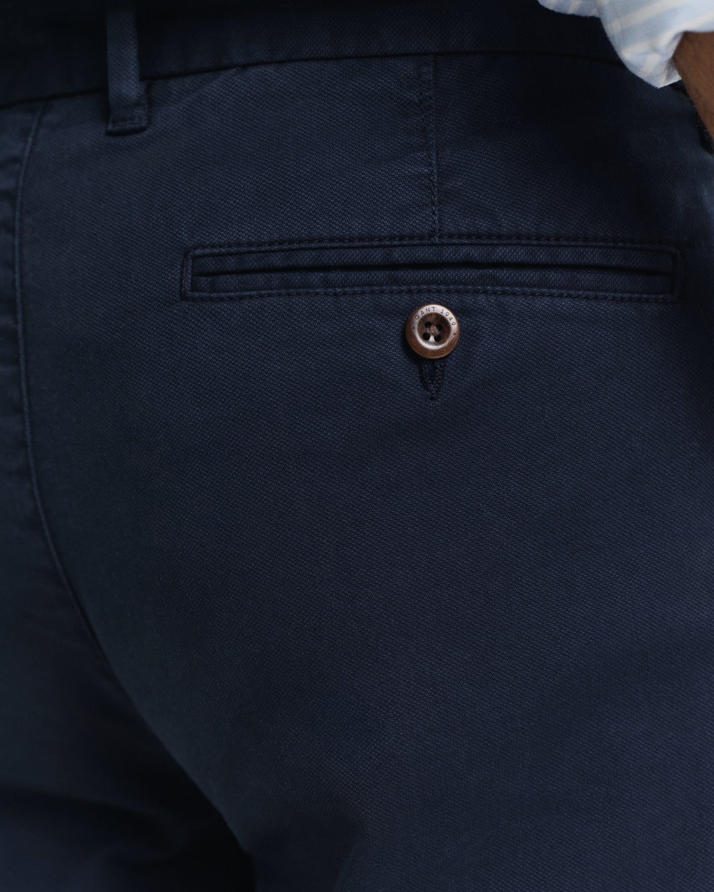 MODEL WEARING SLIM DOBBY STRUCTURE CHINOS