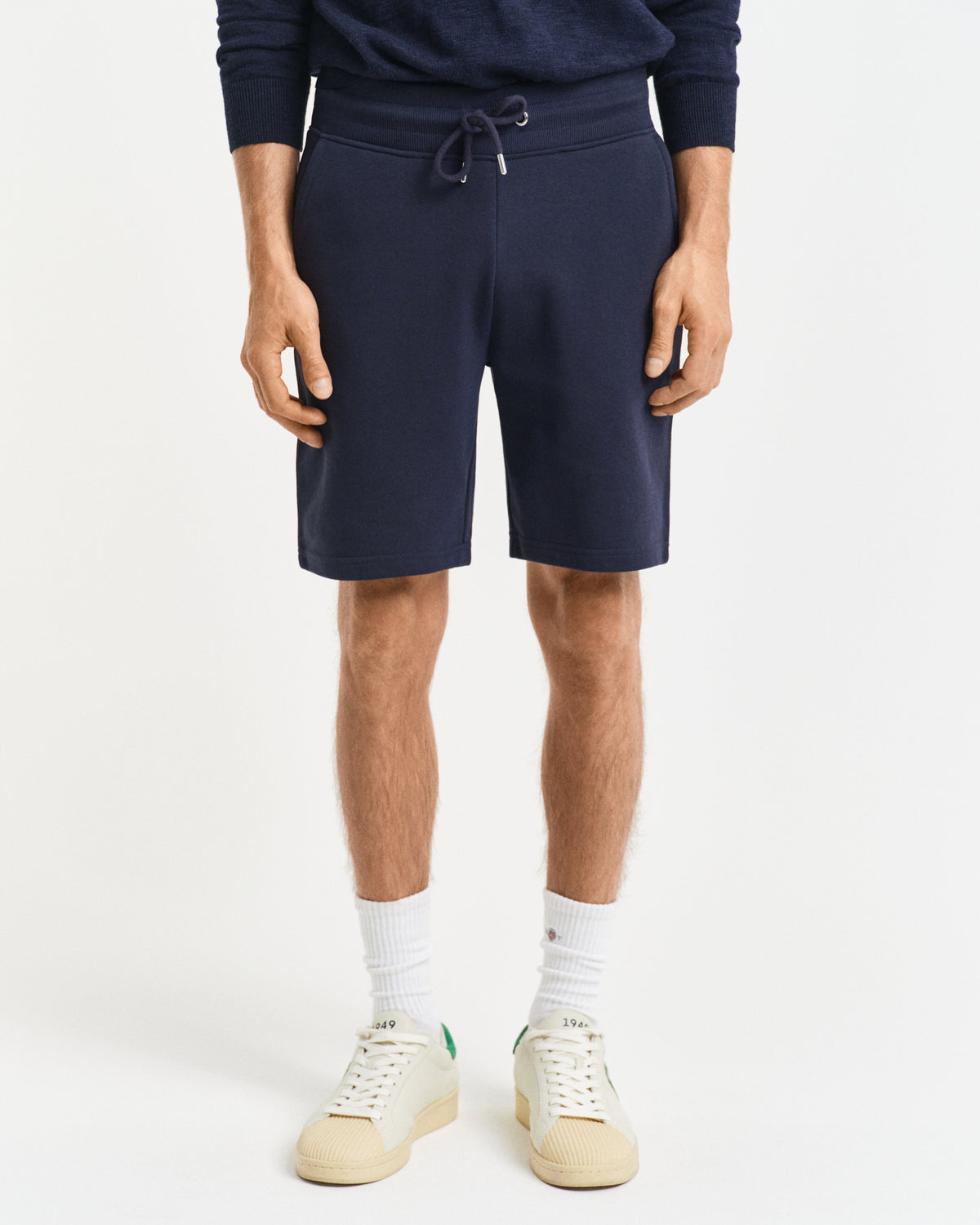 MODEL WEARING REG SHIELD SWEAT SHORTS