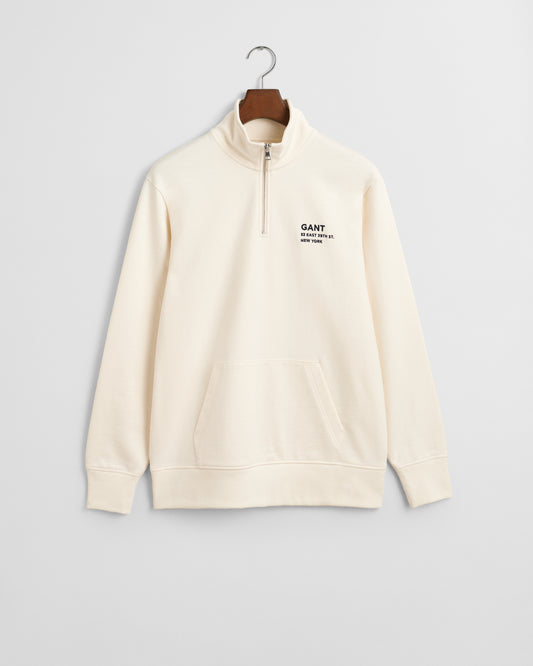 CREAM, SMALL GRAPHIC HALF ZIP SWEAT BY GANT AU.